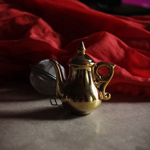 Gold teapot tea infuser
